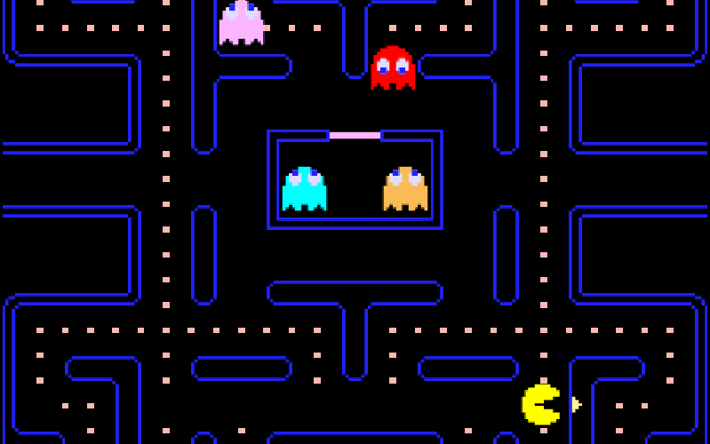 Pac-Man screenshot: Pac-Man eating dots in the blue maze while four ghosts hunt him